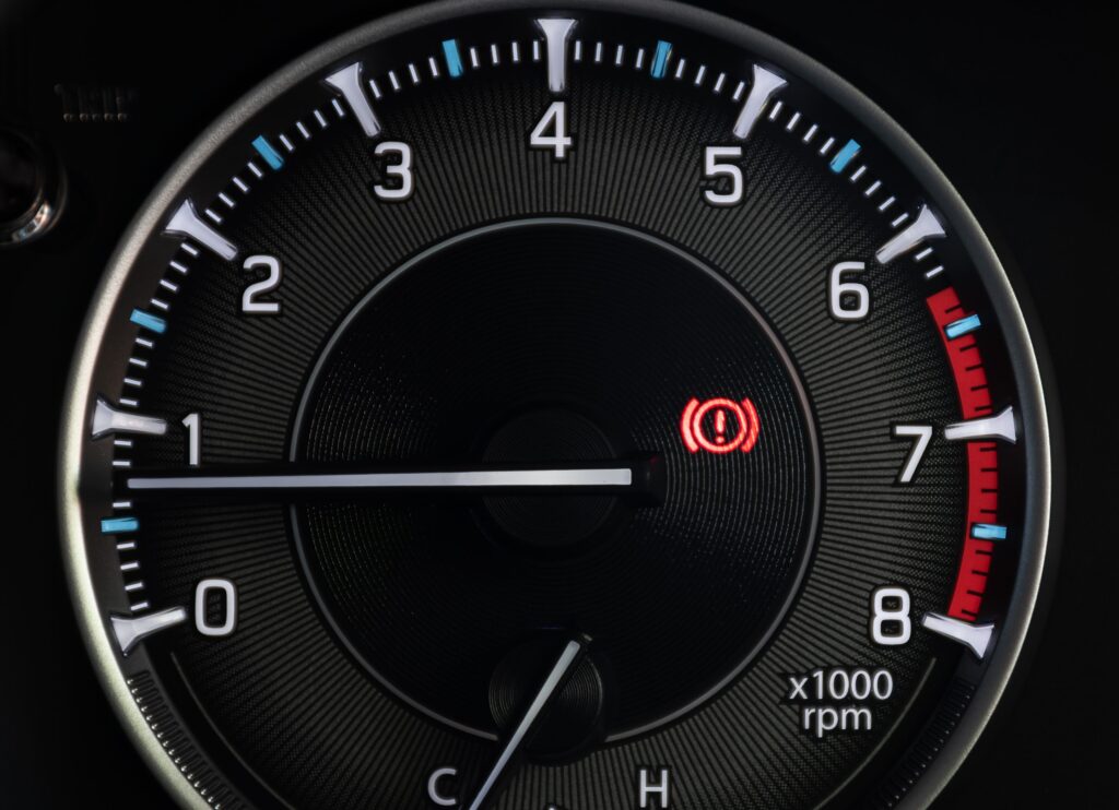 Brake system warning light illuminated on a car dashboard
